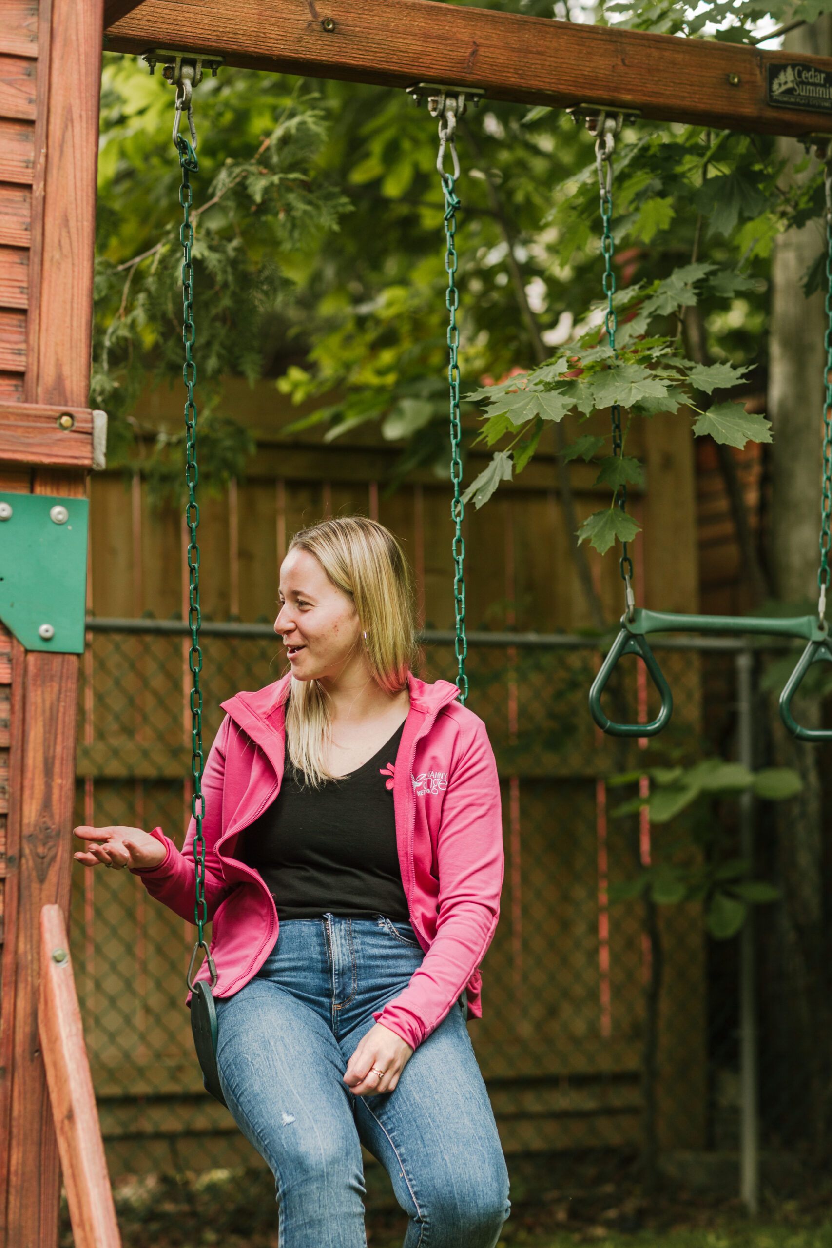 Nankind Volunteer at a play ground with a Nankind child