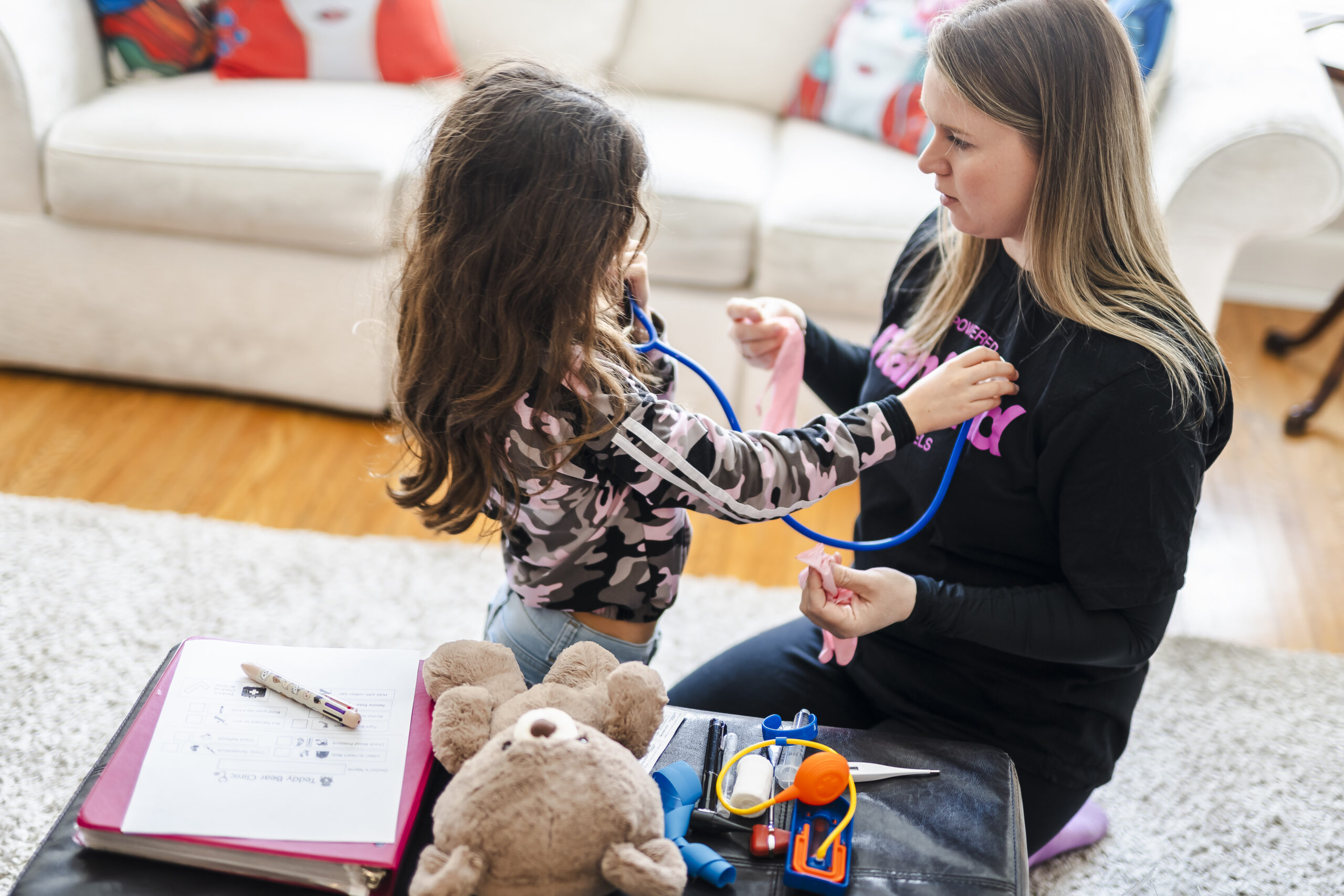 Nankind Child Life Specialist facilitating a Teddy Bear Clinic with a Nankind child.