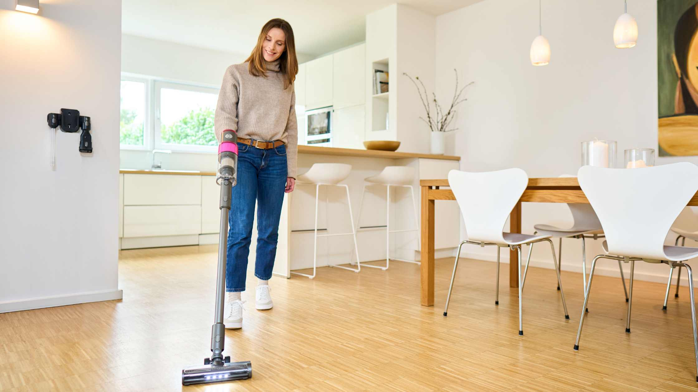Woman cleaning her house with a SEBO Balance A1 Vaccuum